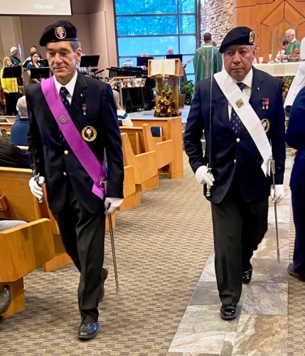 Grand Knight Pierre Gaudreault and  Vic Garcia lead the procession for the gift offering.