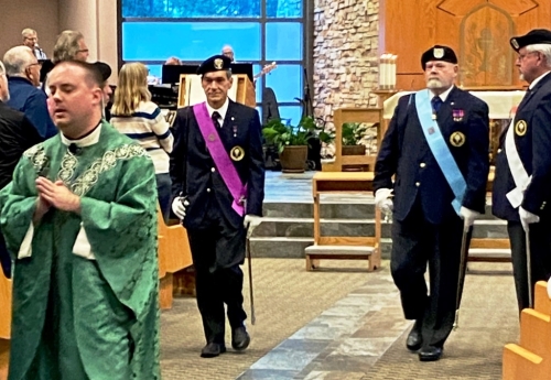 Father Matt Kane leads the closing procession followed by Knights Pierre Gaudreault and Vice Supreme Master Chris Foley.