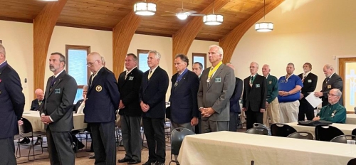 New officers form a cross to remind that first and foremost they are Catholicman, and as a Knights are expected to live by thetenets of their faith and put them into action through leadership skills.